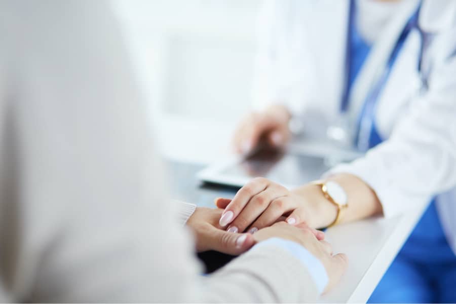 doctor comforting patient